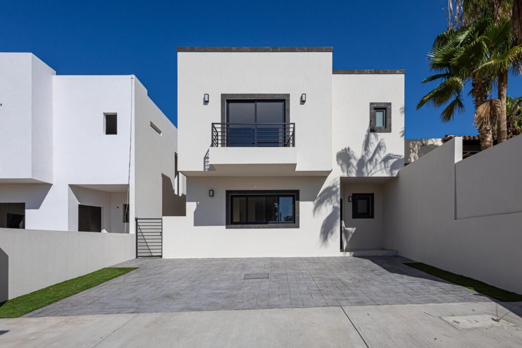 Cabo San Lucas Palma Real Pre-sale Palma Real is a quiet, peaceful, and private community, where you'll be able to find spacious and beautiful houses with 3 bedrooms, 2.5 bathrooms, 2 car parking, kitchen with granite counter top, closets, 10,000L water tank, and patio. Pool and common area, ideal to spend time with friends and family. Located near major shopping malls, banks, gas stations, cinema, and city center. Excellent investment opportunity due to its price and finishes. Upgrade: Synthetic Grass, Mini splits & Garage Pergola – Cam. Del Cerro, Cabo San Lucas, BS